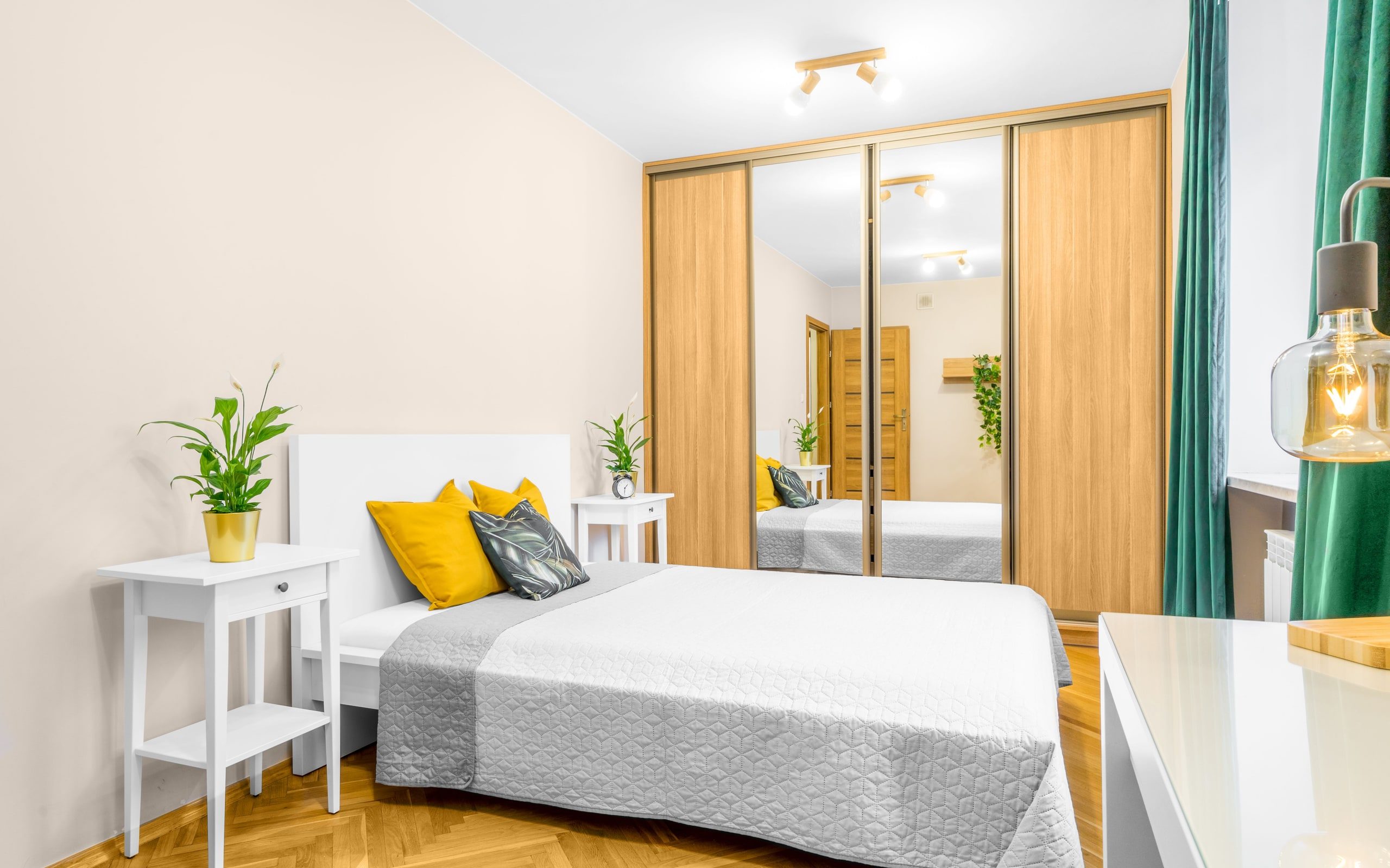 A made bed in a bright bedroom