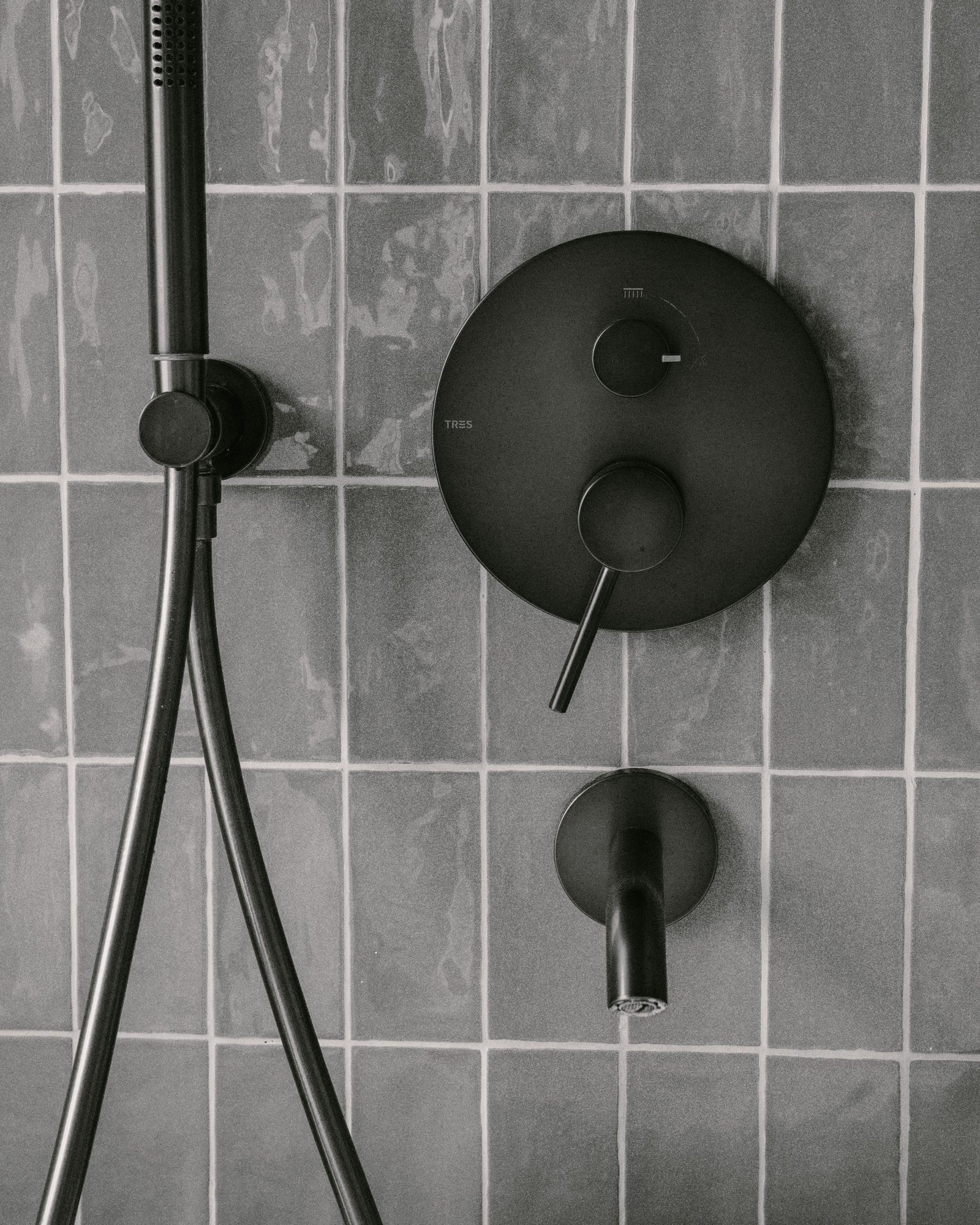 A finished bathroom with a fully tiled shower