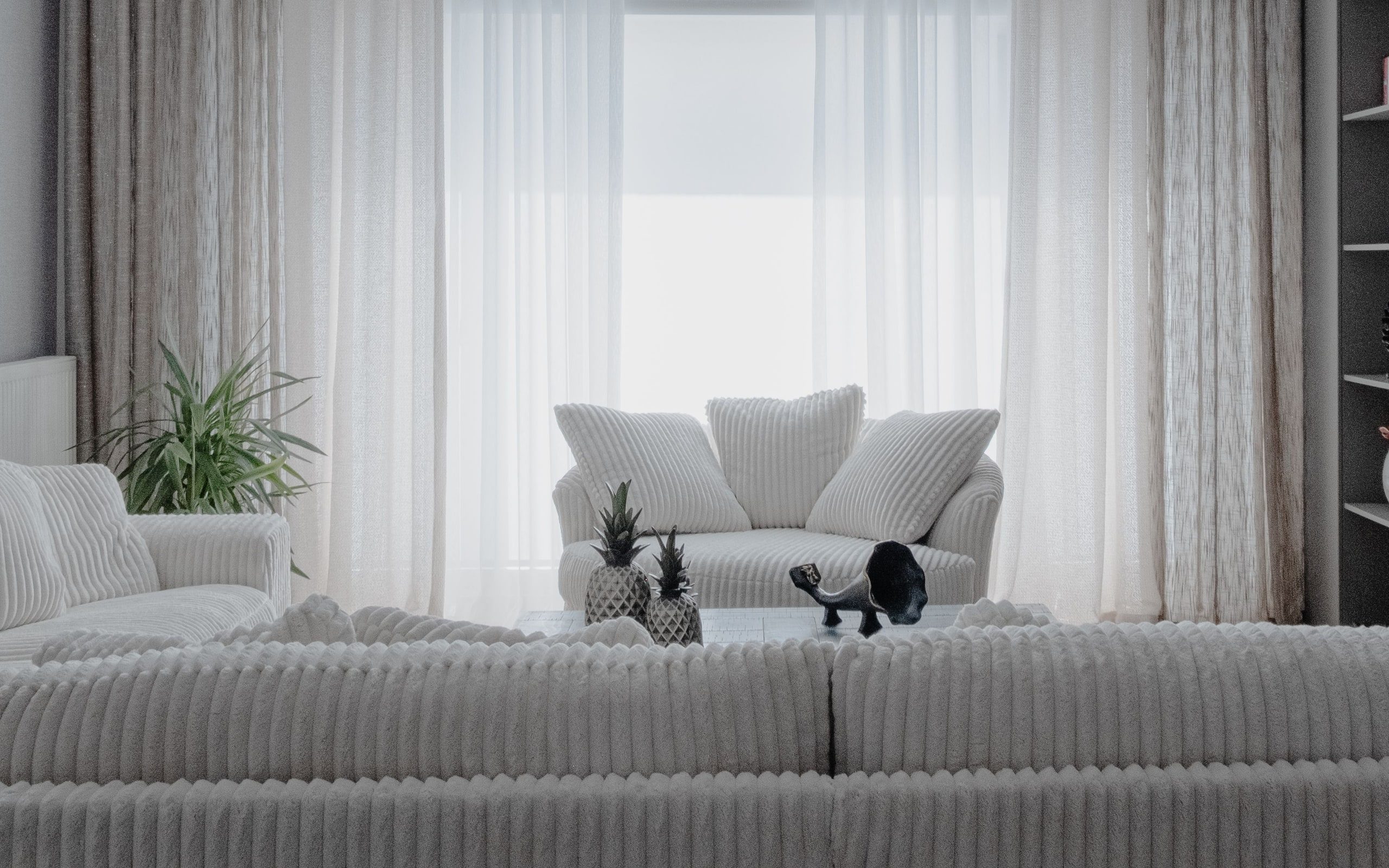 A minimalist living room with large windows