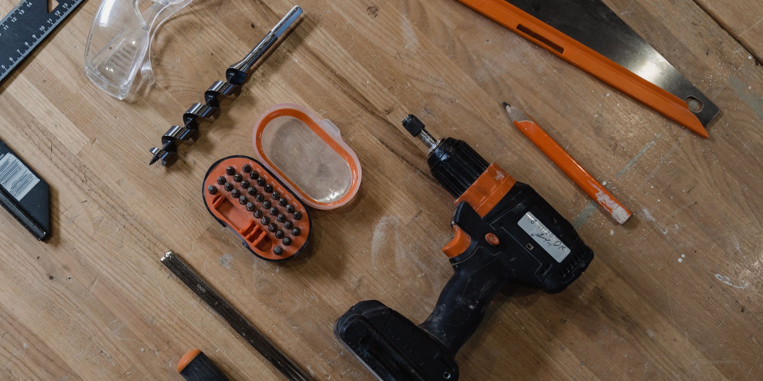 Hand tools laid out on a bench