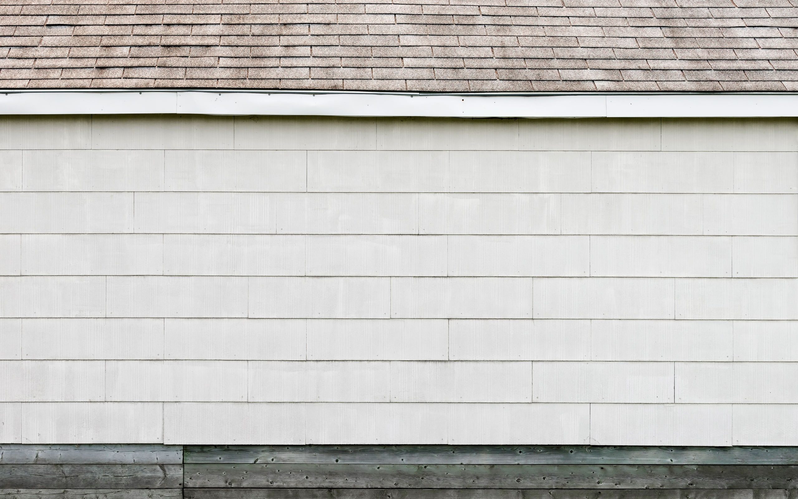A roofline and siding seen close up