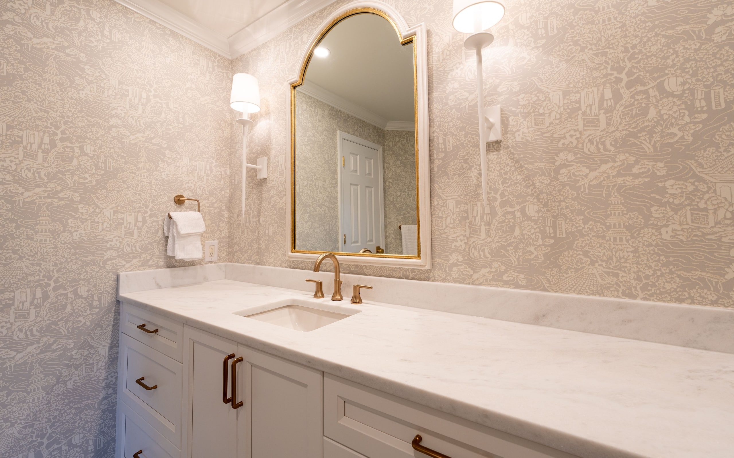 Reference image: bathroom vanity in stone with a brass tap