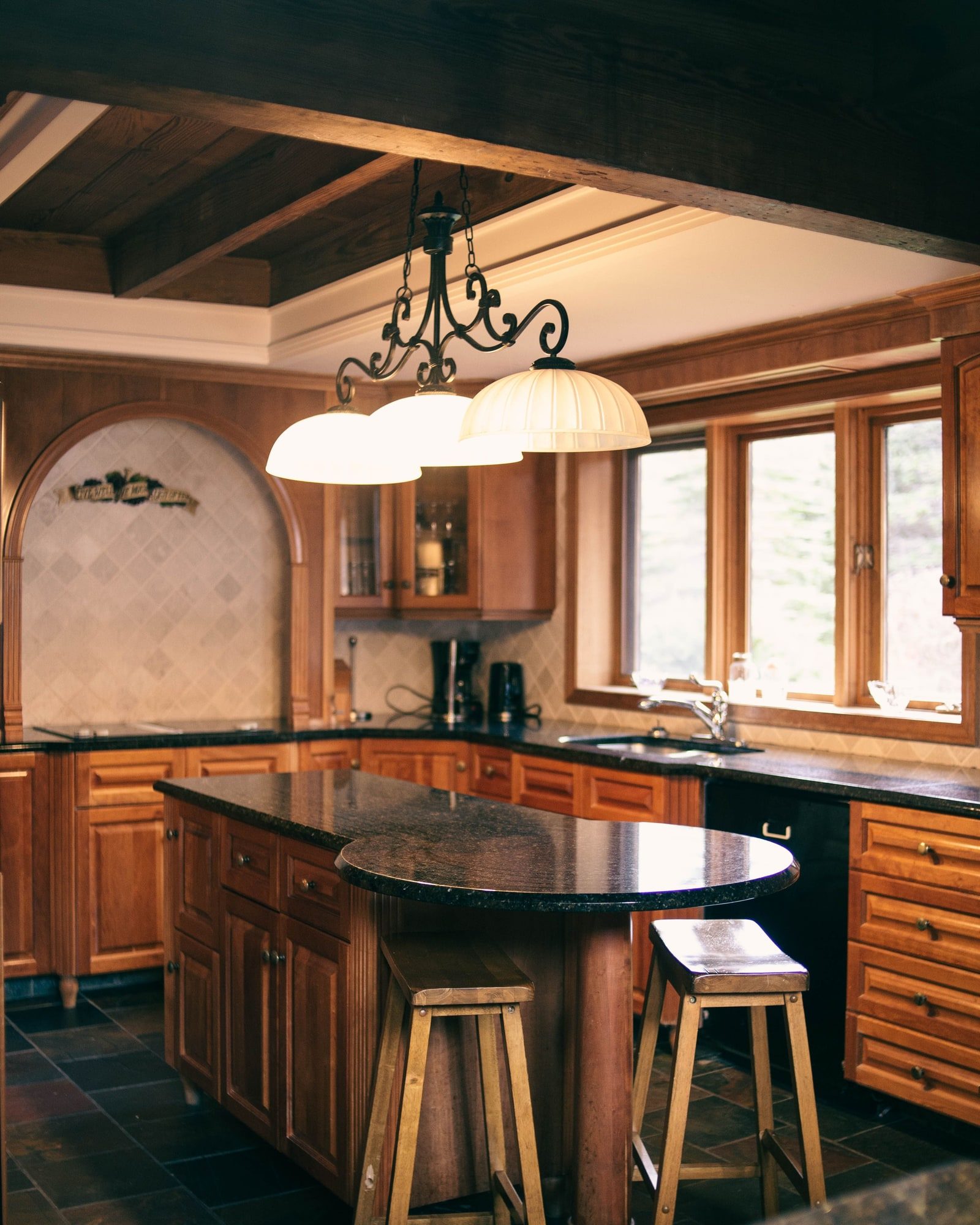 A kitchen island with a stone countertop